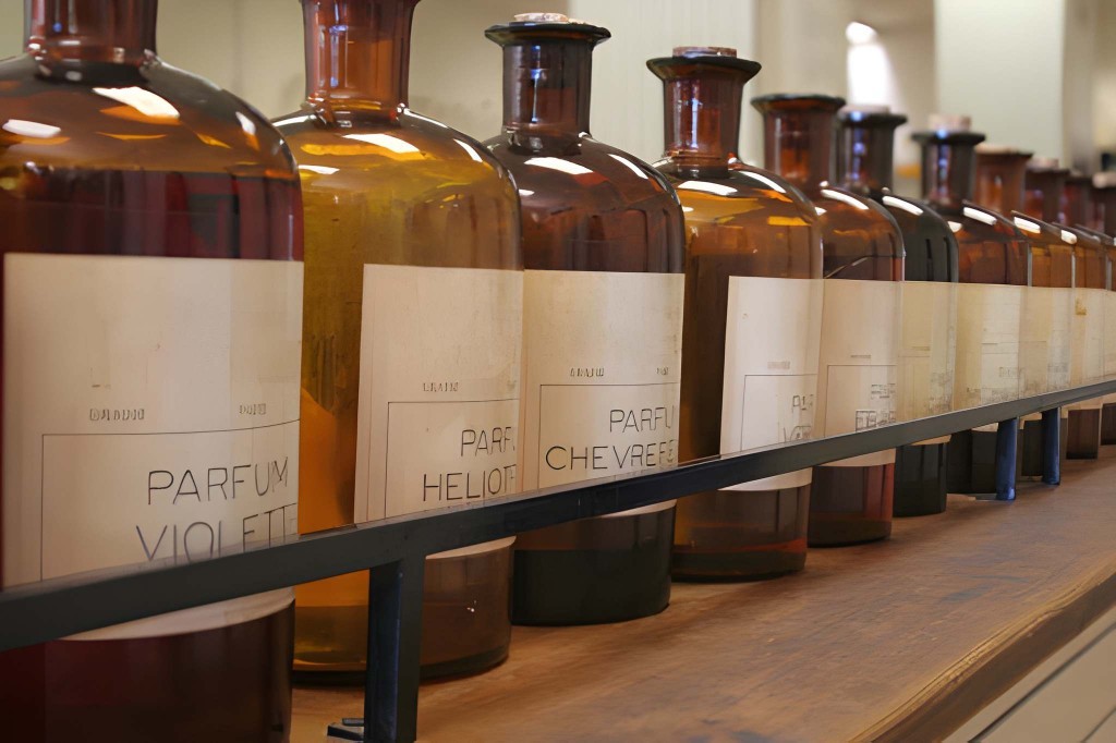 Amber formula bottles on a perfumery shelf